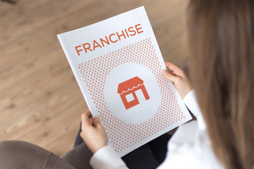 Business owner reviewing a Franchise Disclosure Document to understand disclosure agreements and protect sensitive franchise information.
