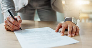 the best franchise and business lawyer in san antonio signing a franchise disclosure document on a desk